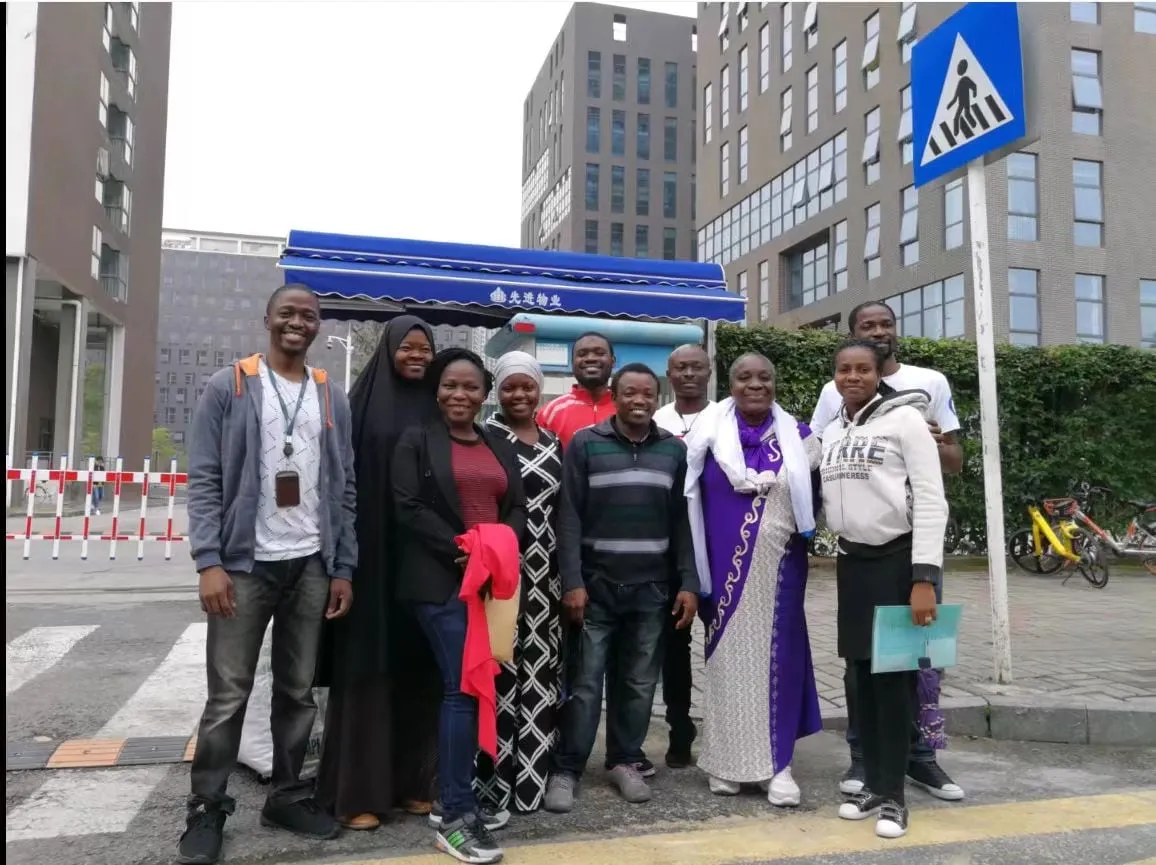 Members of Nigerians in Shenzhen standing together on a street in Shenzhen